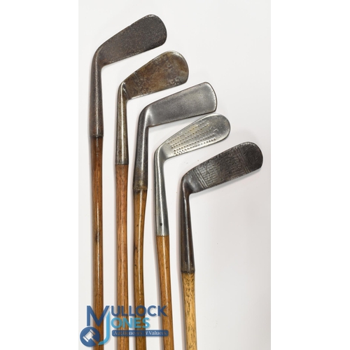 7 - 5x Assorted golf clubs incl a rustless jigger, mid iron with the toe arrow mark, St Andrews Golf Co ... 