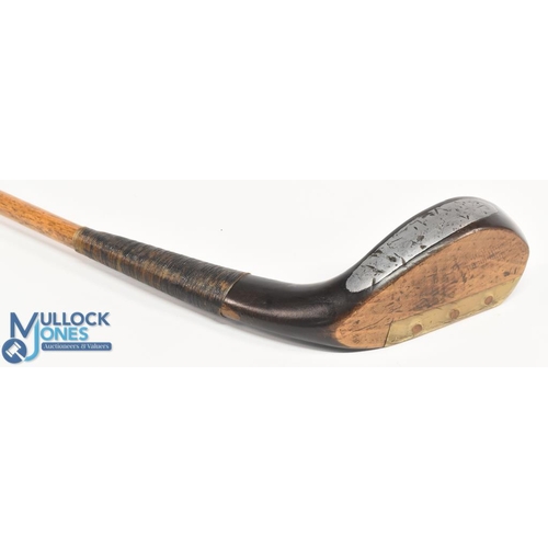 709 - An A Patrick c1885 longnose dark stained beechwood putter the hickory shaft fitted with a full lengt... 