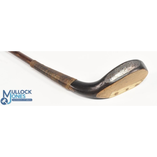 712 - c1890 R Simpson of Carnoustie broad head long nose putter in dark stained beechwood, the hickory sha... 