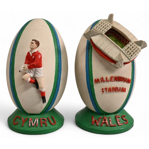 94 - Pair of Large Heavy Ceramic Welsh Rugby Ball shaped figures (2): One with model of the Millennium/Pr... 