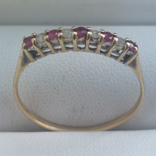 110 - 9ct gold Ruby and cz ring size T