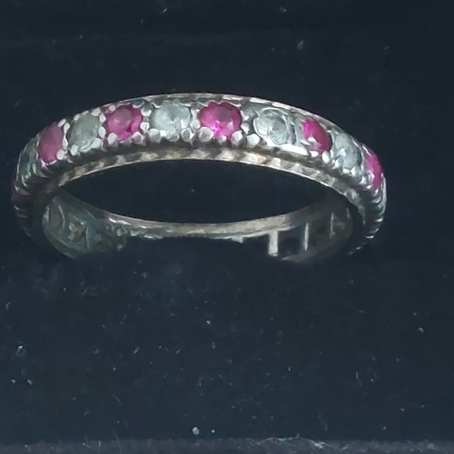 03A - 9ct gold and silver ( marks rubbed) ruby/cz eternity ring