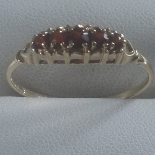 0021 - 9CT GOLD FIVE STONE STONE GARNET RING