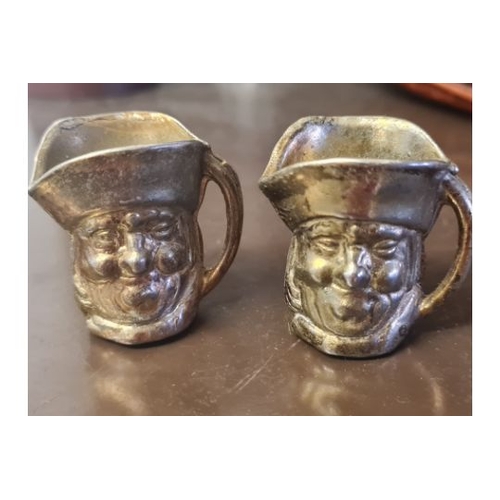 18A - 2 small brass toby jugs