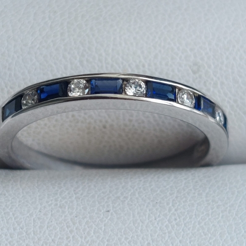 014A - .925 silver sapphire and cz channel ring  size T