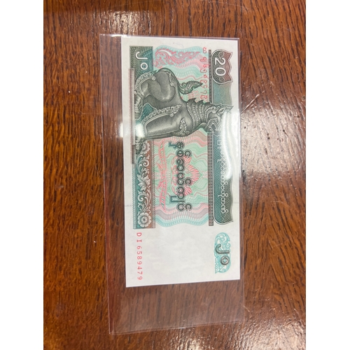 27 - Uncirculated foreign bank note