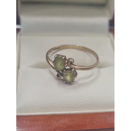 09L - 9ct gold ladies ring with large green stones size  n/o

No Reserve