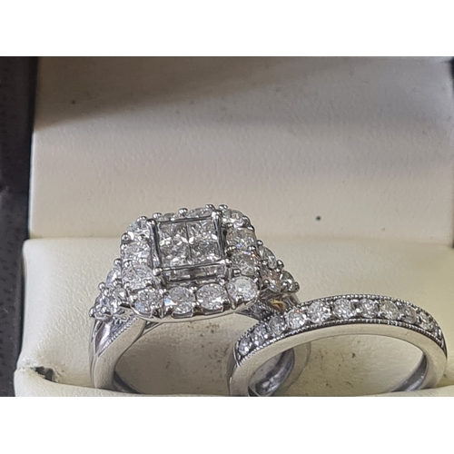 06S - 9ct white gold wedding set 2 ct diamonds

1.6 carat in engagement ring 
0.4 ct in wedding band size ... 