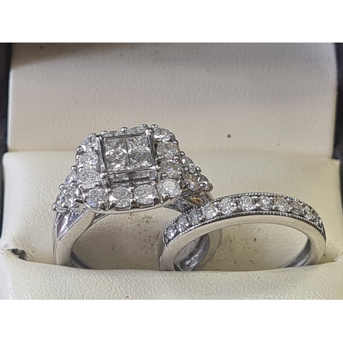 06S - 9ct white gold wedding set 2 ct diamonds

1.6 carat in engagement ring 
0.4 ct in wedding band size ... 