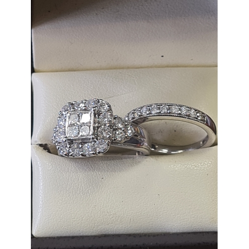 06S - 9ct white gold wedding set 2 ct diamonds

1.6 carat in engagement ring 
0.4 ct in wedding band size ... 