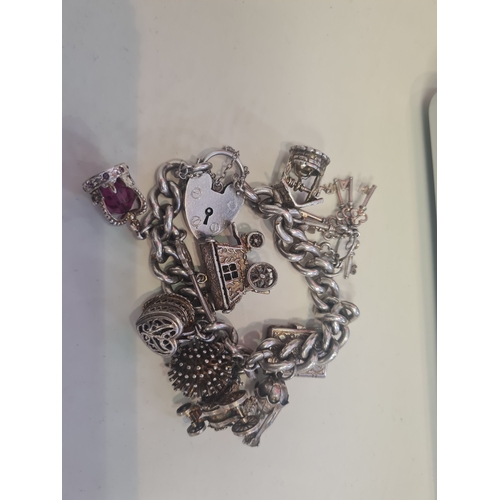 351 - Large heavy silver 925 bracelet with larhe charms