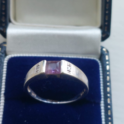 004I - 9ct white gold and amethyst ring. Box included