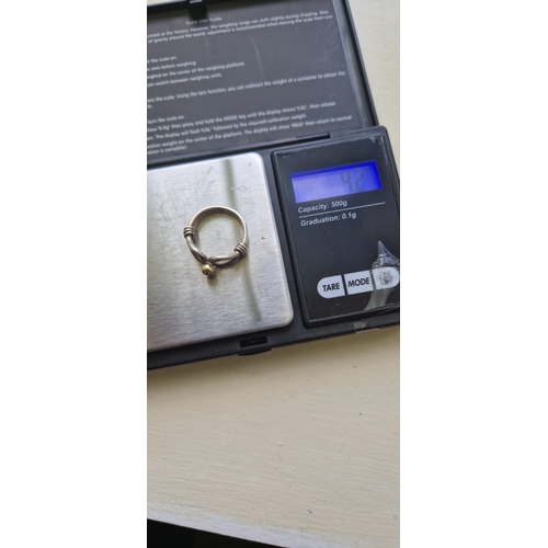 16Q - 9ct gold and silver ring,  tested. Size k