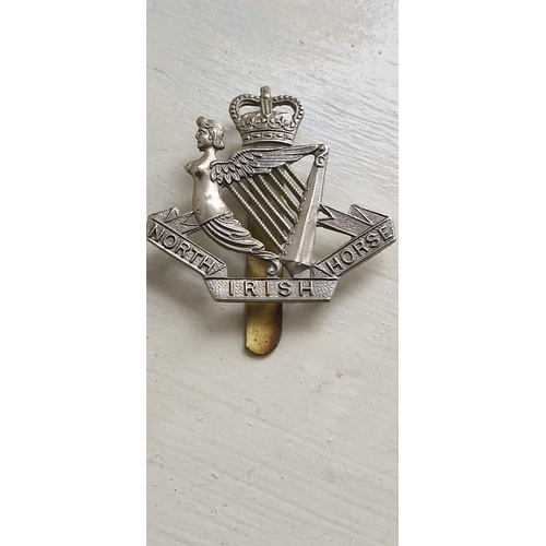 513 - North Irish Horse cap badge. QE II