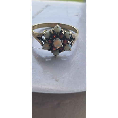 91 - Opal and garnet ring.  Indistinct marks. Size Q. 2.7 grms