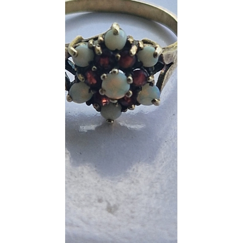 91 - Opal and garnet ring.  Indistinct marks. Size Q. 2.7 grms