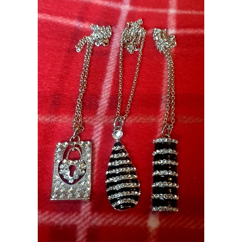 461 - A trio of ladies Diamante pendants on chains