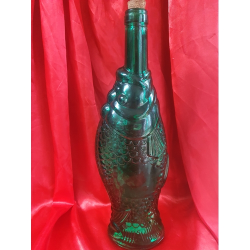 429 - Vintage green glass tall fish bottle