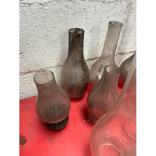 101 - Collection of oil lamp glass chimneys.