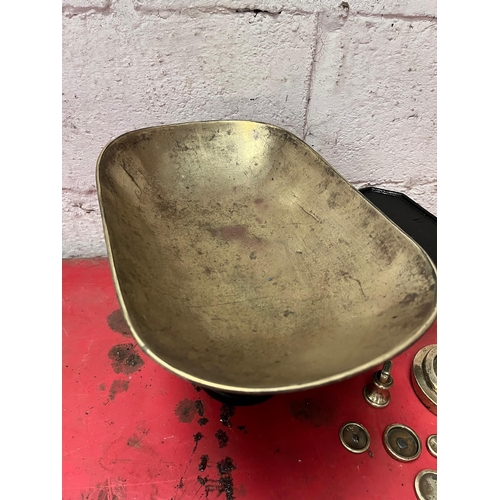 20 - Cast iron weighing scales with brass dish and weights.