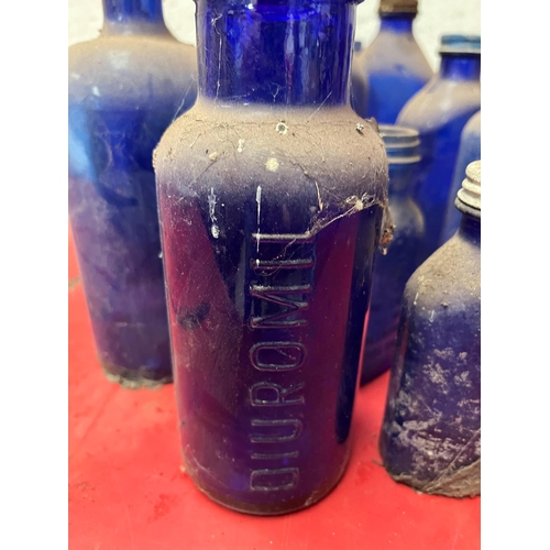 24A - Collection of Vintage blue bottles.