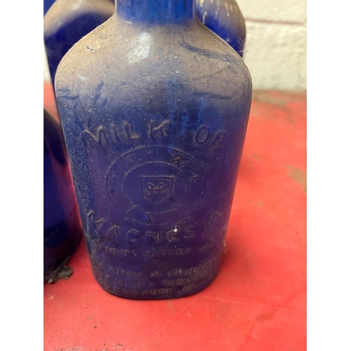 24A - Collection of Vintage blue bottles.