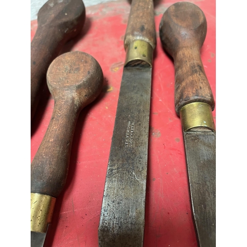 26 - Antique screw drivers with wooden handles.