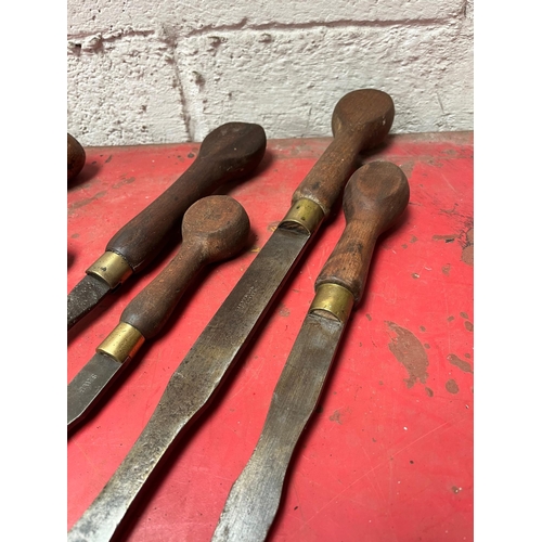 26 - Antique screw drivers with wooden handles.