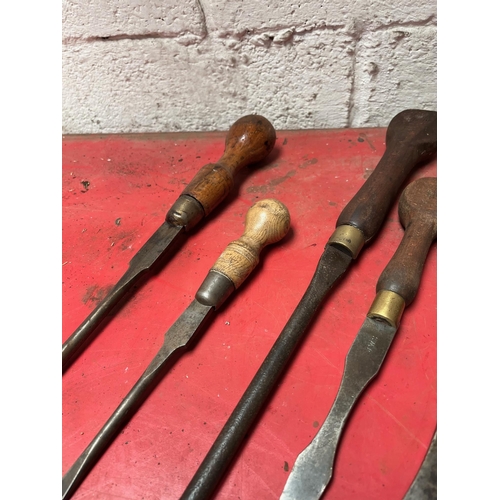 26 - Antique screw drivers with wooden handles.