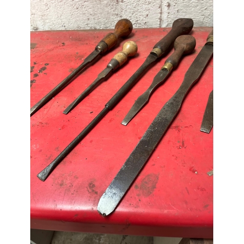 26 - Antique screw drivers with wooden handles.