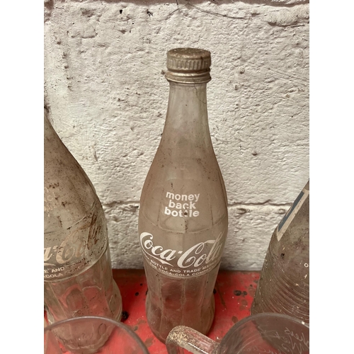 39 - Vintage mineral bottles, glasses, and beer mats.