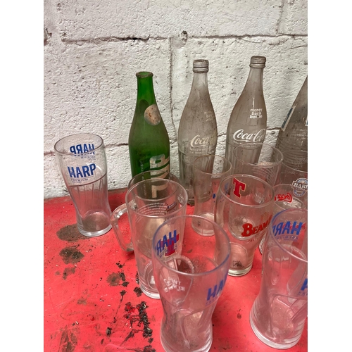 39 - Vintage mineral bottles, glasses, and beer mats.