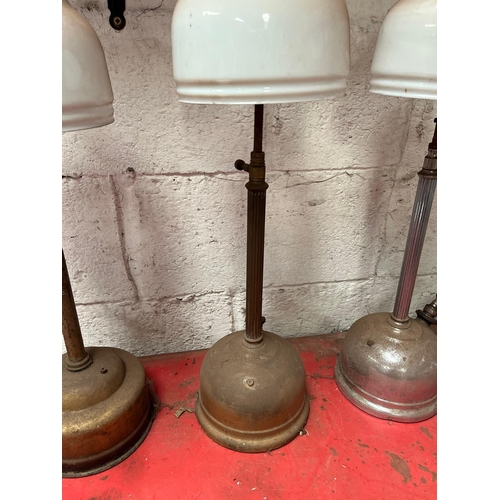 43 - Four Antique Tilley lamps.