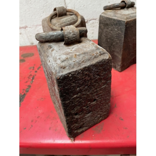 83 - Four Antique weights.