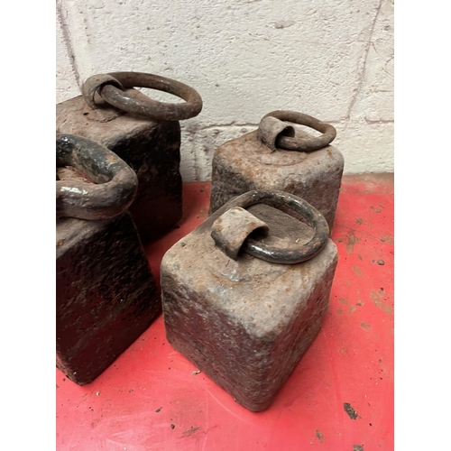 84 - Four Antique weights.