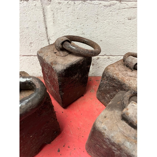 84 - Four Antique weights.