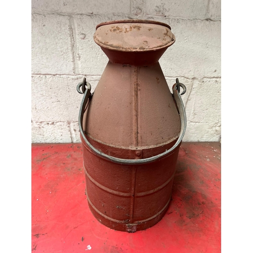 48 - Antique metal oil churn with handle.