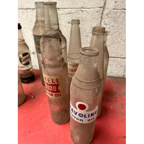 53 - Collection of Vintage oil bottles.