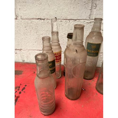 53 - Collection of Vintage oil bottles.