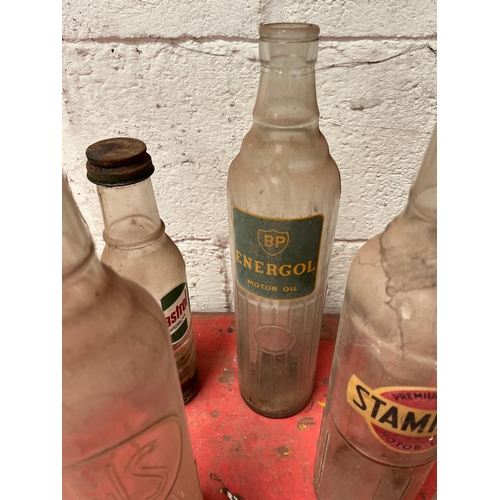 53 - Collection of Vintage oil bottles.