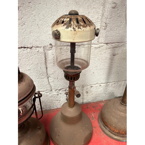 59 - Antique brass Tilley lamps.