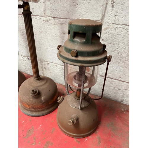 59 - Antique brass Tilley lamps.