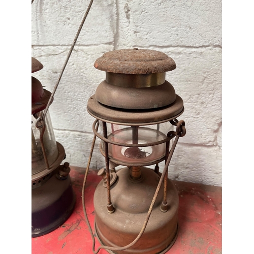 65 - Antique brass and metal Tilley lamps.