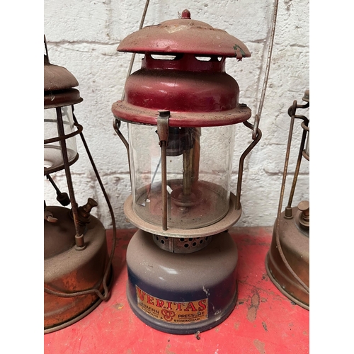 65 - Antique brass and metal Tilley lamps.