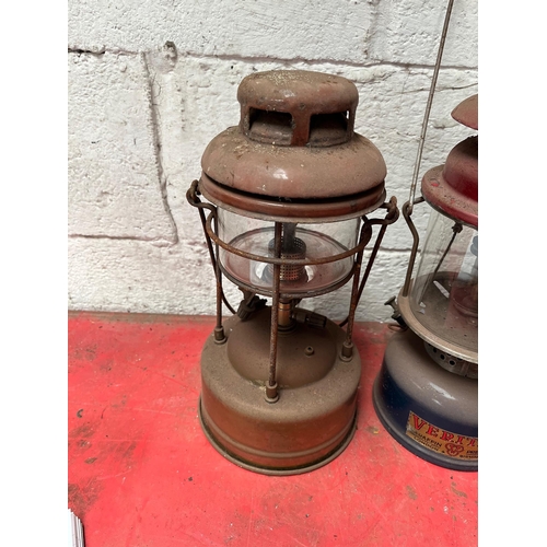 65 - Antique brass and metal Tilley lamps.