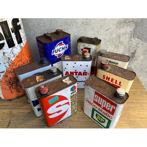 442 - Collection of vintage oil cans. {30 cm W x 48 cm H}