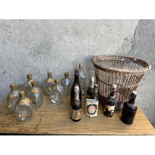 448 - Selection of bottles and a wicker basket.