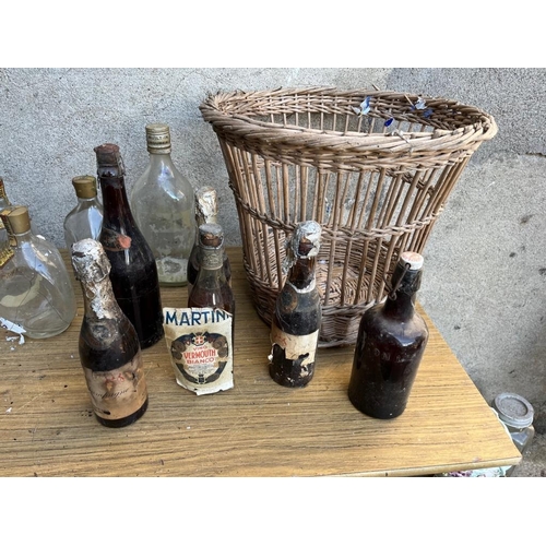 448 - Selection of bottles and a wicker basket.