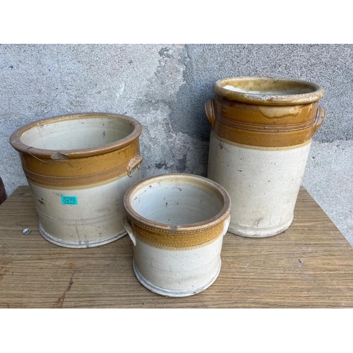 475 - Three graduated earthenware pots, Bristen Stoneware. {Largest 32 cm W x 42 cm H}