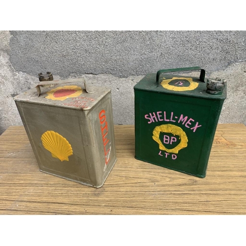 1 - Two Shell oil cans complete with brass tops. {W 25 cm x H 32 cm x D 15 cm}